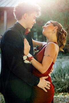 Young couple lovingly looking at each other, dressed up