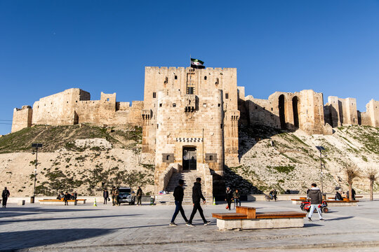 People Walking by Citadel of Aleppo Syria