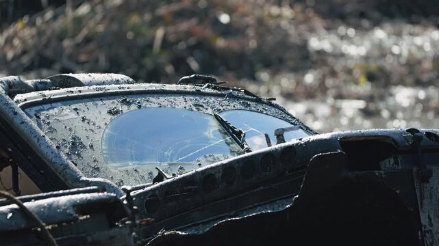 Close up of rugged 4x4 vehicle splattered with mud during intense off road competition. Wipers clear windshield for visibility. Extreme motorsport challenge