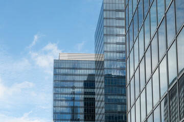 Fototapeta premium Brussels, Belgium. Modern glass office buildings with reflections of urban skyline and telecommunications tower