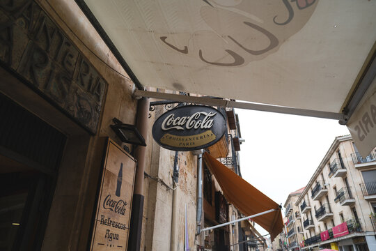 Coca Cola sign in Salamanca Spain with historic architecture