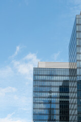 Fototapeta premium Brussels, Belgium. Modern glass office buildings with urban reflections and large blue sky copy space