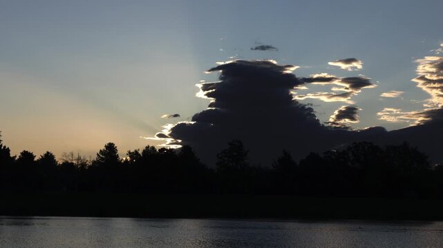 Morning Sun Emerging Behind Storm Clouds Timelapse