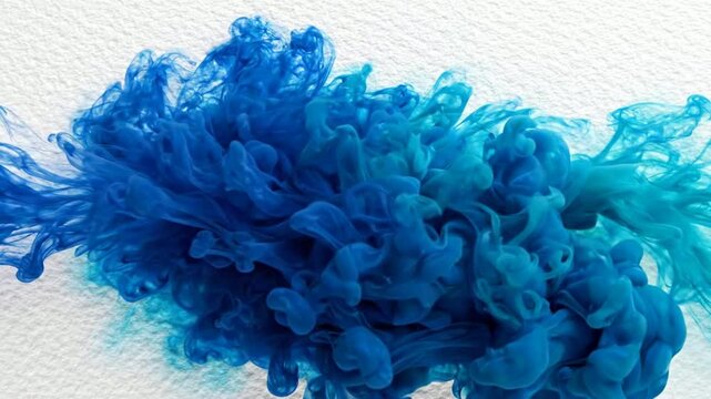 Abstract blue ink cloud swirling in water, slow motion liquid paint explosion background
