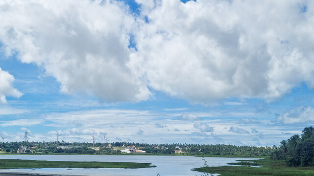 Lagoon and Wind Turbines in Trairi, Ceara, Brazil Under Dramatic Cloudy Sky