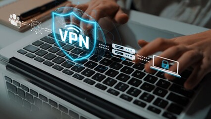 Fototapeta premium Person Working on Laptop with VPN Technology Concept Shield and Cybersecurity Elements on Keyboard for Remote Access and Online Privacy Sigmoid