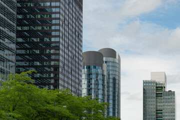 Fototapeta premium Brussels, Belgium. Modern office towers with green foreground and urban business district skyline