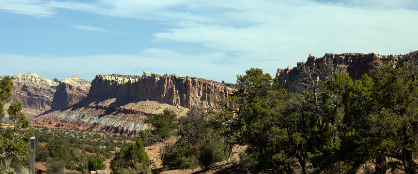 Ultrawide panorama of the Waterpocket Fold, a massive 100 mlle long &ldquo;wrinkle&rdquo; in the Earth's crust, from Capitol Reef National Park Scenic Drive, Utah SR 24