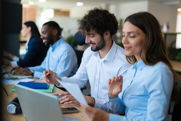 Fototapeta premium Diverse business team collaborating in shared office space