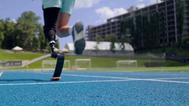 Trained man jogger with bionic leg prosthesis starts running