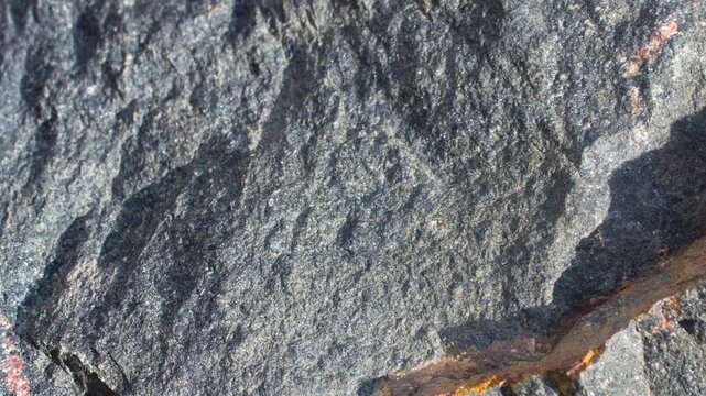 Granite rock. Boulder, rock face. Raw, authentic granite mineral rock, animation