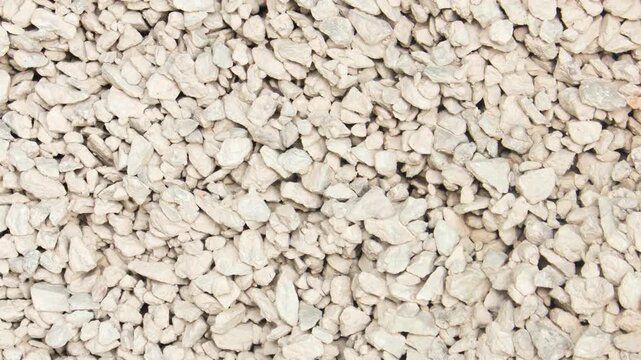 Crushed stone. Pebbles for the construction industry, concrete production. Light-colored pebbles, stones, quarry, pile,animation