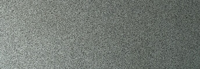 Fototapeta premium Terrazzo cement background with black and white stone grains scattered all over concrete floor