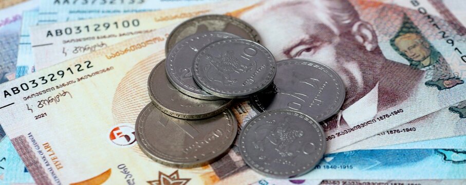 Georgian lari money bills and coins on table. Georgia cash of GEL currency close up