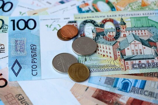 Belarusian ruble money bills and coins on table. Belarus cash of BYN currency close up