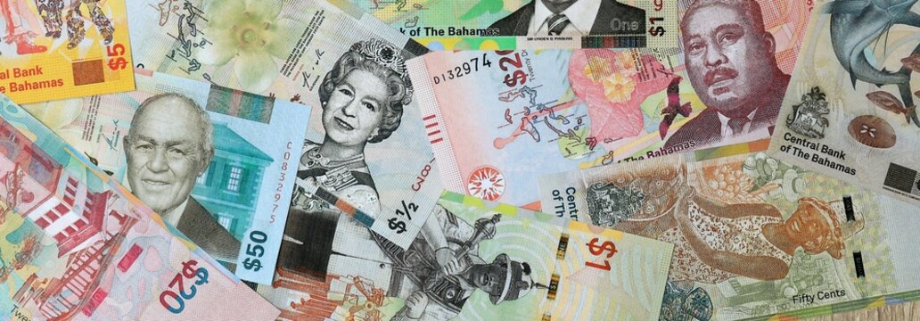 Bahamian dollar money banknotes bunch on table. Bahamas bills of BSD currency close up