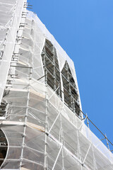 Fototapeta premium Urban Construction Project with Scaffolding for Modern Building Renovation