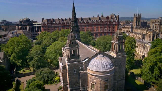 Aerial footage of the Old Town in Edinburgh, Scotland, focusing on a historic church