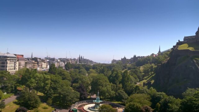Aerial view of Edinburgh Castle and Princes Street Gardens on a sunny day in Scotland
