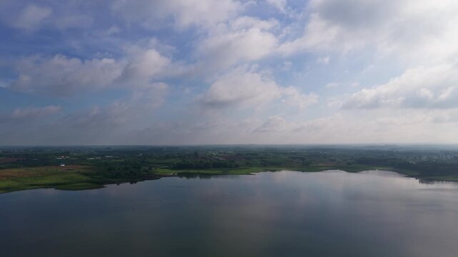 Views of Ho Cau Moi in Dong Nai, Vietnam with clouds and water
