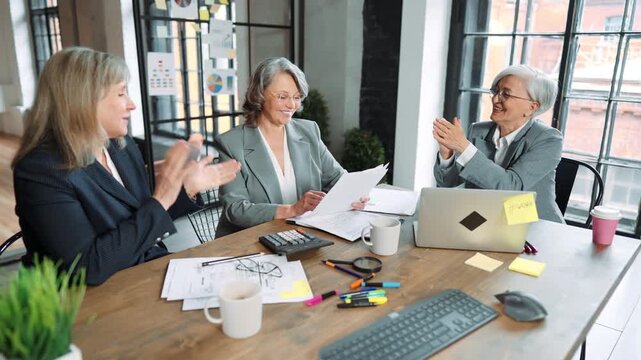 Women in business, three senior ladies discussing contract and startup in office . Chief accountant and financial director in boardroom, negotiation with boss of company, teamwork and communication