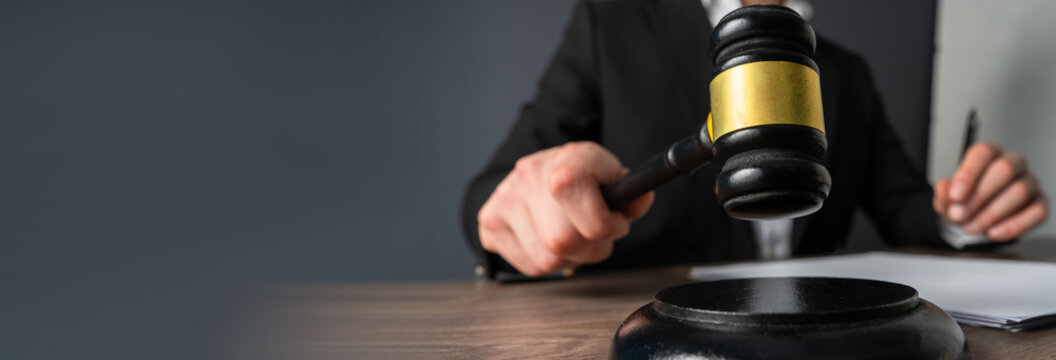 A judge&rsquo;s gavel used in court to signal rulings, maintain order, and symbolize judicial authority and justice.