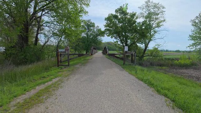 Immersive POV from a bike ride on KATY trail near Hermann, Missouri - springtime morning after heavy storm