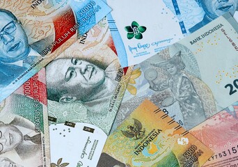 Indonesian rupiah money bills in pile on table. Indonesia IDR currency cash close up © Viktor