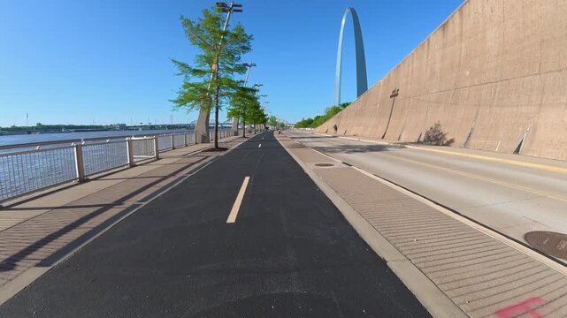 Immersive POV from a bike ride on the St Louis Riverfront trail along the Mississippi River towards Gateway Arch