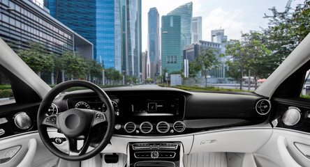 Modern car interior faces urban skyline © Кристина Пахомова