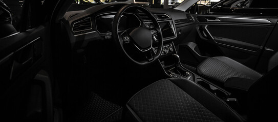 Dark interior shows sleek, modern car design © Кристина Пахомова