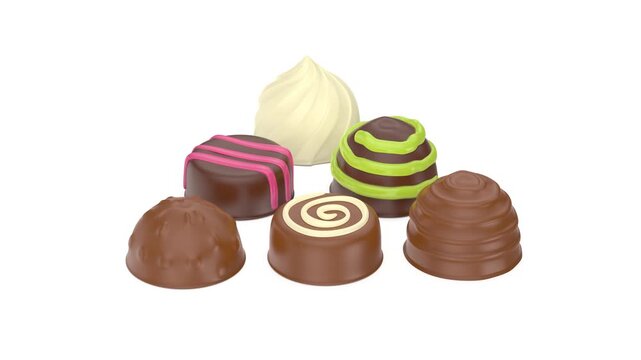Variety of chocolate pralines on white background