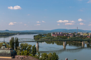 Fototapeta premium Panoramic view of Maria Valeria Bridge over the Danube river connecting Hungary and Slovakia on a sunny day