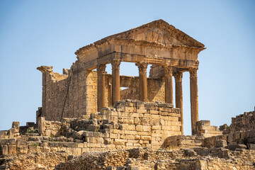 Obraz premium The Capitol in the Roman ruins of Dougga, in Northern Tunisia
