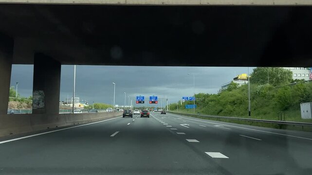 Amsterdam Netherlands highway, Urban highway traffic under a concrete overpass
