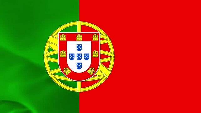 The national flag of Portugal waving in the wind with its iconic red and green colors and coat of arms