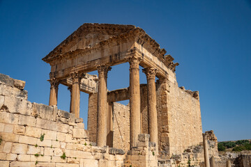 Obraz premium The Capitol in the Roman ruins of Dougga, in Northern Tunisia