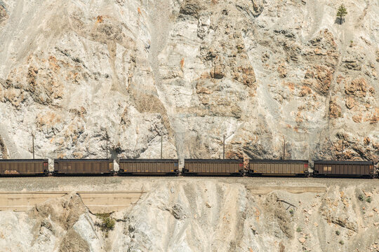 Canada, BC, Spences Bridge.  Coal train passes through various tunnels and slide sheds on the edge of the Thompson Canyon.
