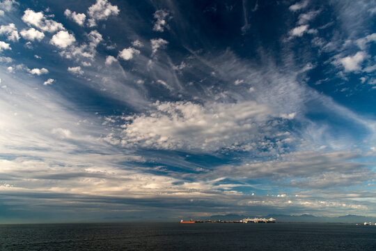 Canada, BC, Delta.  Dramatic clouds over Deltaport,  bulk cargo and container shipping port located 35km south of Vancouver.
