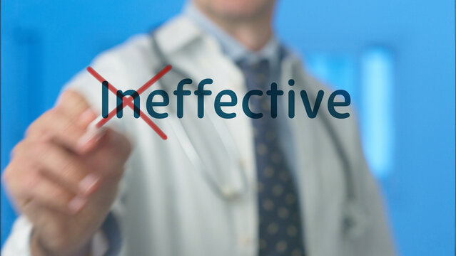 Doctor's hand crossing out ineffective word on a transparent screen, symbolizing a medical professional's commitment to delivering a successful and effective healthcare treatment for patients