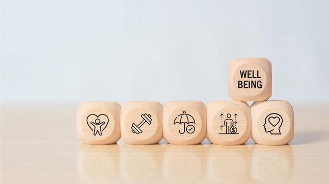 Employee wellbeing concept. Wooden blocks with physical, mental, emotional health icons. Creating employee benefits, satisfaction programs. Fostering positive work culture, employee engagement