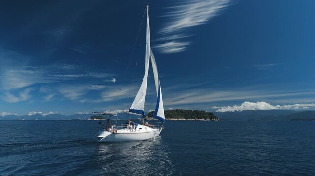 Aerial view of the sailing boat sailing in the sea near the islands close to the town of Paraty and Angra dos Reis in Brazil