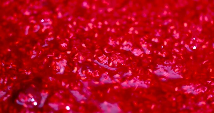 Natural grated raspberries of a rich shade, ripe grated raspberries with pits and sugar are removed from above in the whole mass