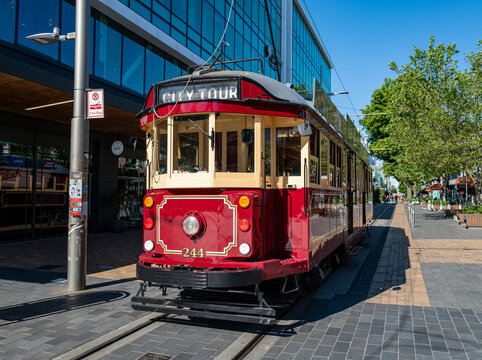 A restored heritage tram runs through central Christchurch, New Zealand, as the city leverages heritage tourism for post-earthquake recovery, November 2025.