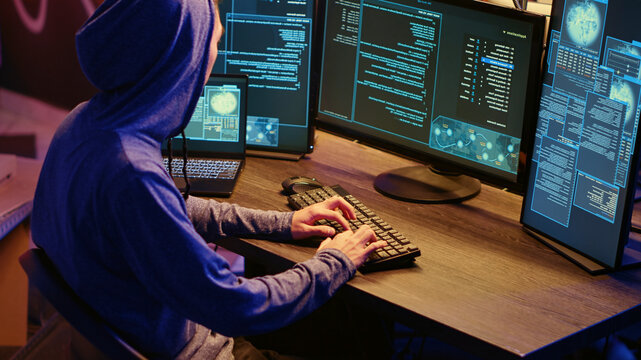 Hackers brainstorming methods of breaching defenses and exploiting weaknesses in computer systems, evil developers in basement getting past companies security networks.
