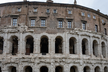 Obraz premium Architectural history in details of ruins, old buildings, walls, amfitheatres, arches in old part of Rome, dated from 300 BC, guided tours in Rome, Italy