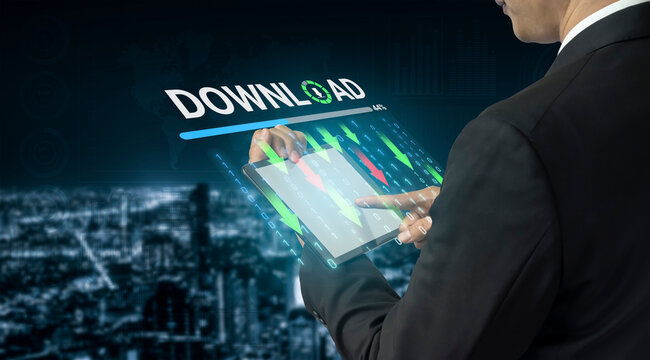 Businessman Analyzing Market Trends on Digital Tablet with Stock Charts and Download Option in Modern Digital Concept. Entropy.
