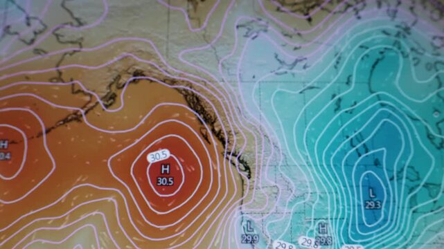 Weather display showing sea level pressure lines low pressure depressions and high pressure systems over Canada USA Europe and Russia on a computer screen.