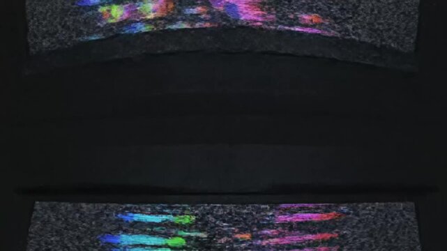 Colorful Static Screen Patterns and Glitch Effects Displayed on Multiple Monitors