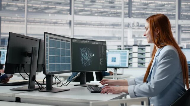 Women working in microchip factory lab training AI assistant to optimize hardware, female engineers in R&D office using AI to improve manufacturing efficiency for semiconductor research.